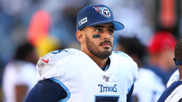Tennessee Titans quarterback Marcus Mariota (8) stands on the sidelines during the game against the Carolina Panthers at Bank of America Stadium.